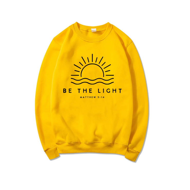 Yellow sweatshirt with Be The Light Matthew 5:14 design Bible verse clothing by Fresh Faith Designs
