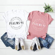 Bible Verse Cotton Tee featuring Psalms 91 design in white and pink with casual denim and sneakers