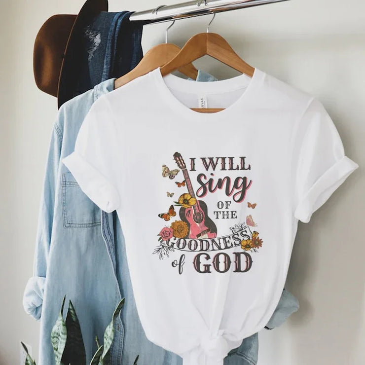 White Bible verse faith shirt for women with guitar and floral design saying I will sing of the goodness of God