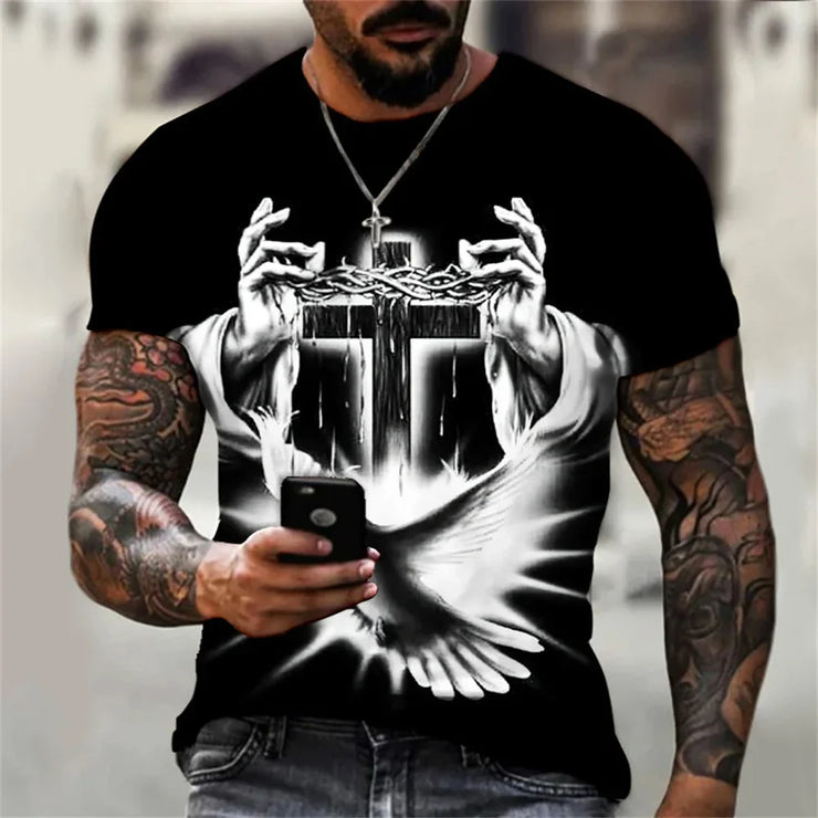 Black casual faith graphic t-shirt with white cross, crown of thorns, and dove design worn by tattooed man