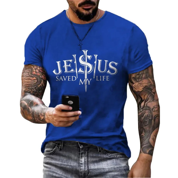 Blue casual faith graphic t-shirt with Jesus saved my life text worn by tattooed man