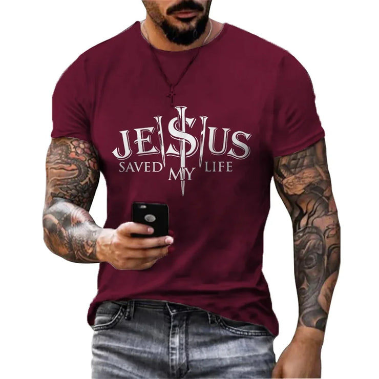 Man wearing a maroon casual faith graphic t-shirt with Jesus Saved My Life design holding a phone