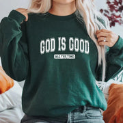 Woman wearing dark green sweatshirt with God Is Good print, Christian apparel for women by Fresh Faith Designs