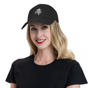 Black Christian baseball cap with white faith cross design worn by smiling woman in black shirt