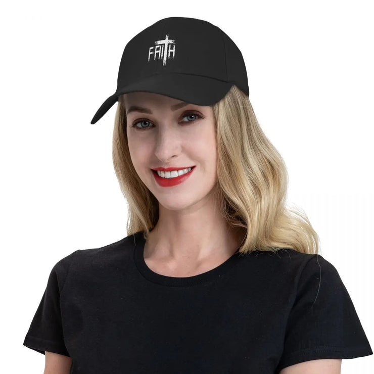 Black Christian baseball cap with white faith cross design worn by smiling woman in black shirt