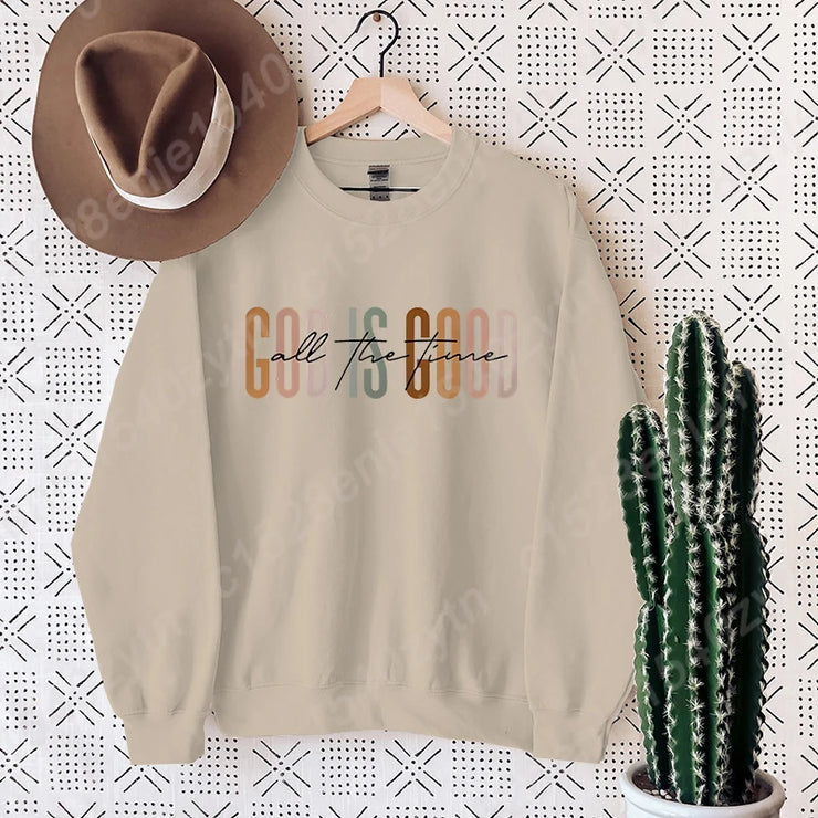 Beige Christian clothing women sweatshirt with colorful call to good text and matching brown hat