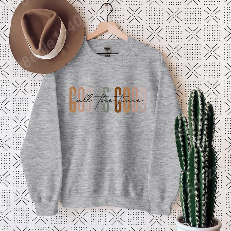 Gray sweatshirt with colorful All The Fence text hanging with brown hat and cactus Christian clothing women