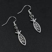 Silver Christian fish earrings with the word Jesus cut out on black background