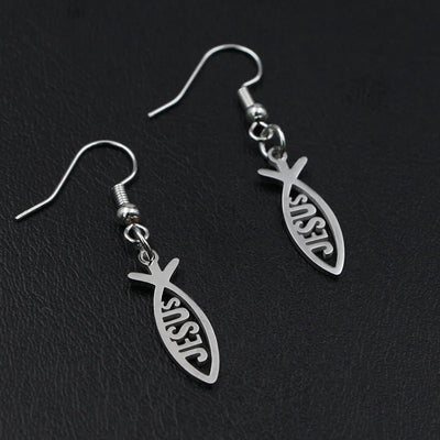 Silver Christian fish earrings with the word Jesus cut out on black background