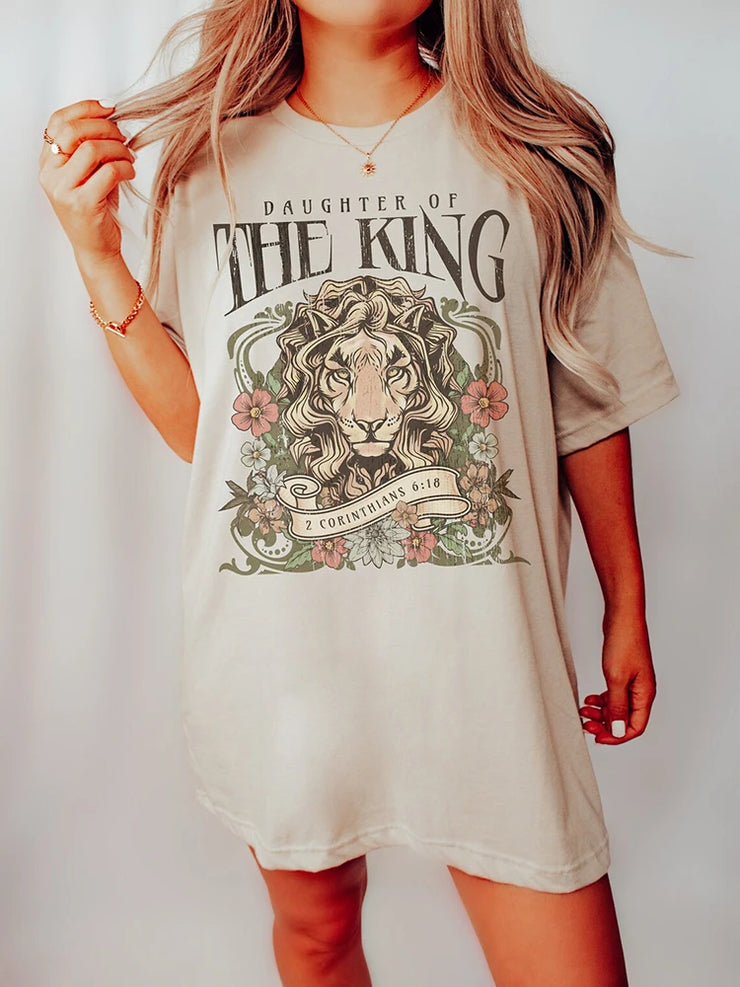 Christian graphic tee for women by Fresh Faith Designs featuring Daughter of the King lion design