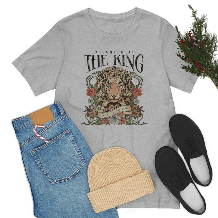 Fresh Faith Designs Christian graphic tee for women with Daughter of the King lion print in gray
