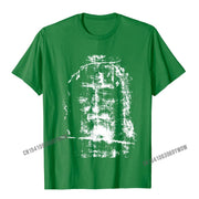 Green Christian Graphic Tee featuring a distressed white cross design on the front