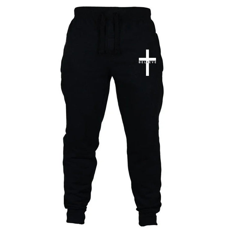 Black Christian jogging pants with white cross and believe text design by Fresh Faith Designs