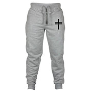 Gray Christian jogging pants with drawstring waist and black cross design with believe text