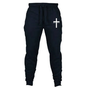 Black Christian jogging pants with white cross and believe text by Fresh Faith Designs