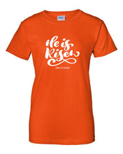 Orange t-shirt with He is Risen design and God is Good text Christian seasonal clothing by Fresh Faith Designs