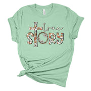 Fresh Faith Designs green t-shirt with floral cross and true story print Christian seasonal clothing