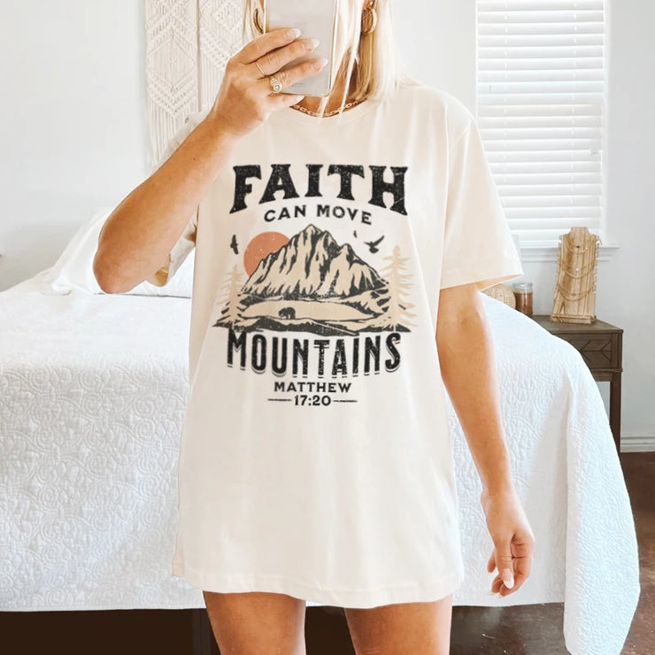 Christian women's graphic tee in white with Faith Can Move Mountains Matthew 17:20 design