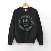Black Christian women's sweatshirt with faith over fear script and decorative wreath design
