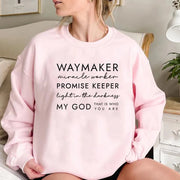 Pink Christian women's sweatshirt with Waymaker miracle worker Promise Keeper text by Fresh Faith Designs