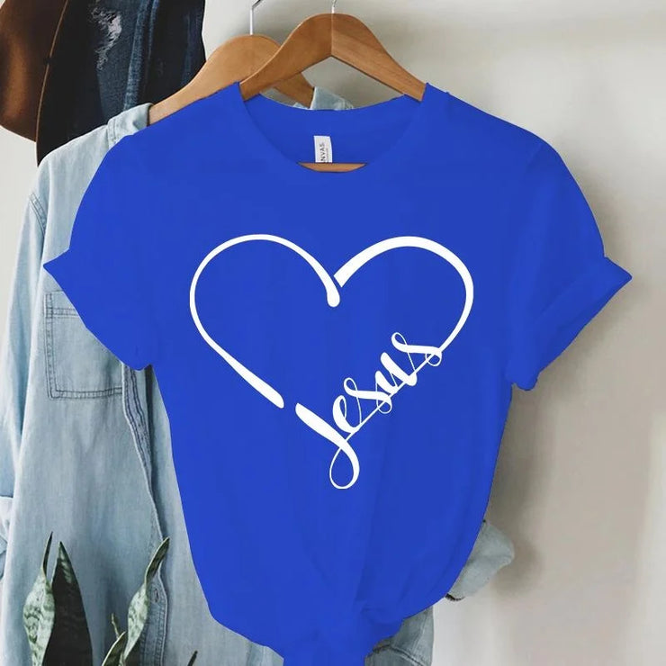 Blue Christian women's t-shirt with white heart and Jesus script design hanging on wooden hanger
