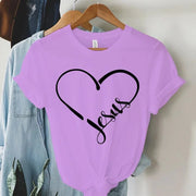 Lavender Christian women's t-shirt with black heart and Jesus text design hanging on wooden hanger