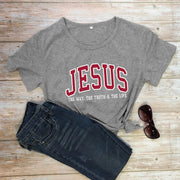 Christian women's vintage t-shirt in gray with Jesus slogan styled with dark jeans and sunglasses