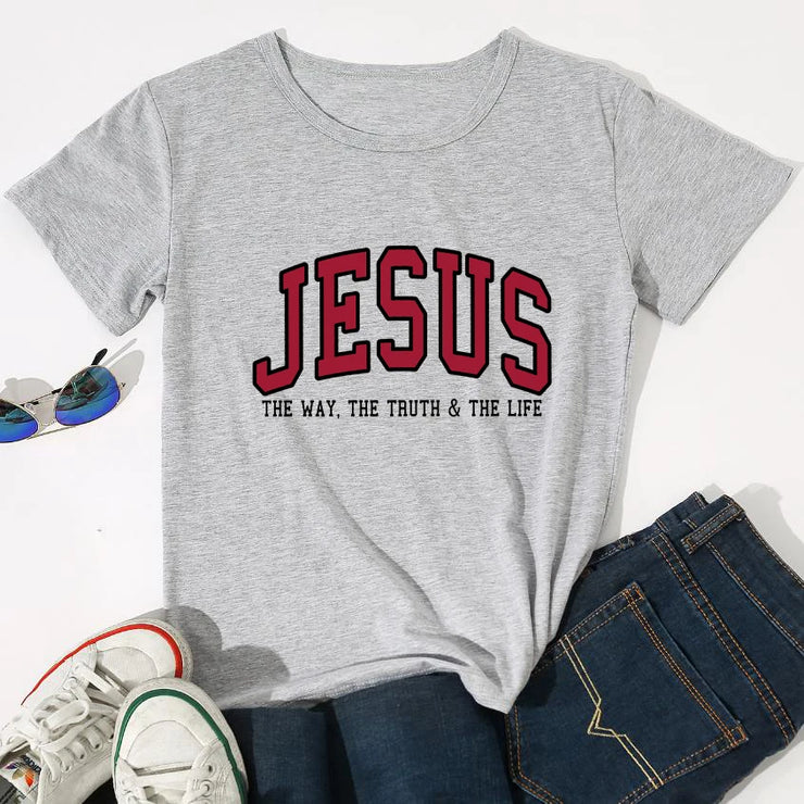 Christian women's vintage t-shirt in gray with Jesus graphic and scripture text styled with jeans and sneakers
