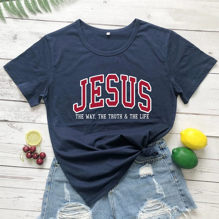 Christian women's vintage t-shirt in navy with Jesus text and distressed denim shorts styled with lemons and cherries