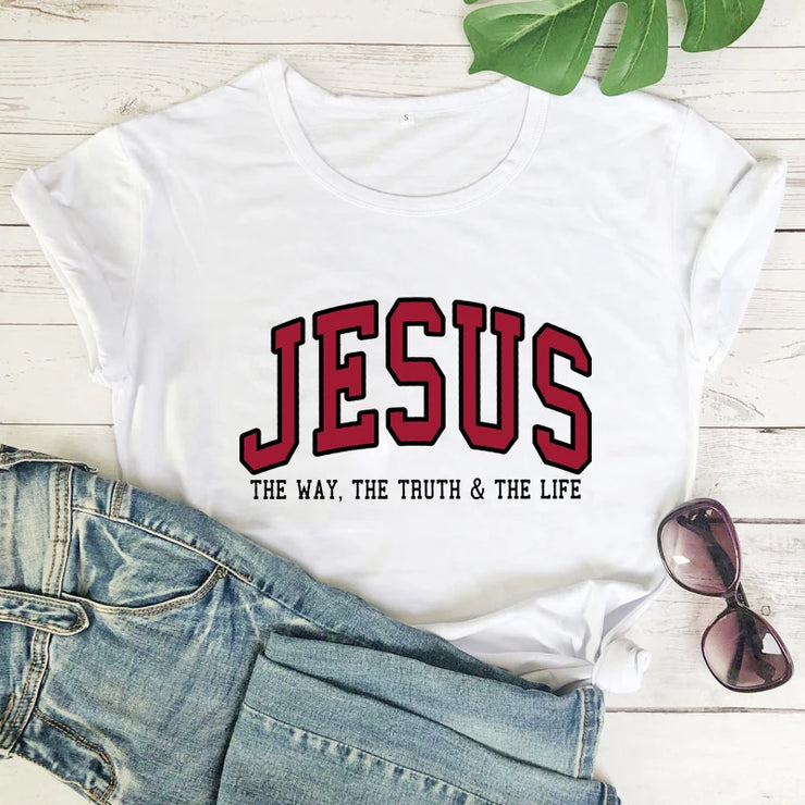 Christian women's vintage t-shirt by Fresh Faith Designs white shirt with JESUS text and jeans sunglasses