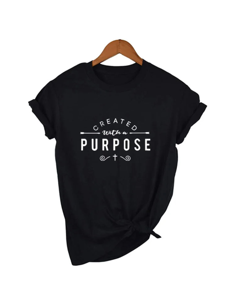 Black Created with a Purpose shirt from Fresh Faith Designs with white inspirational text and small cross
