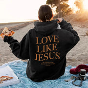 Black hoodie with Love Like Jesus text on back, featured in Faith based apparel by Fresh Faith Designs