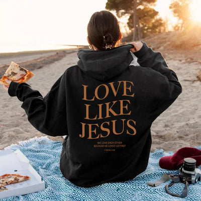 Black hoodie with Love Like Jesus text on back, featured in Faith based apparel by Fresh Faith Designs