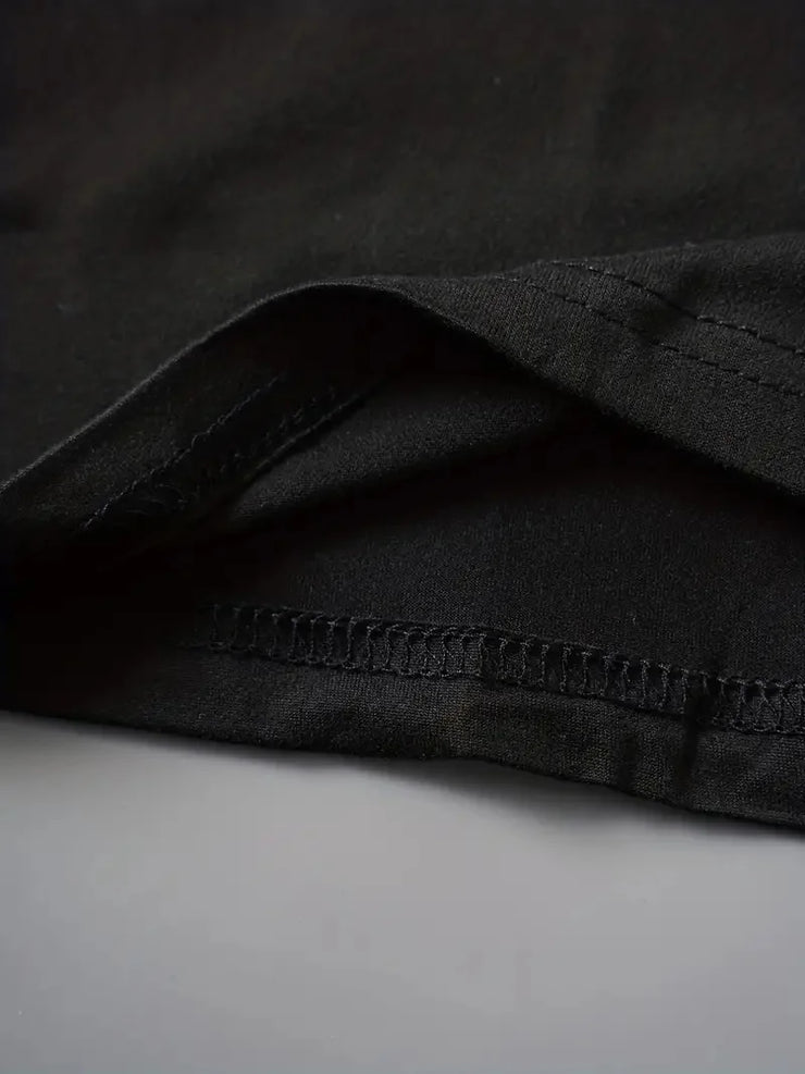 Close-up of black fabric hem detailing on faith-based casual clothing by Fresh Faith Designs