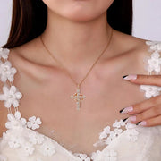 Elegant faith-based cross necklace with crystal accents worn on woman in floral white dress by Fresh Faith Designs