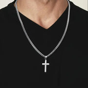 Silver cross necklace on man wearing black shirt faith based jewelry gift for son