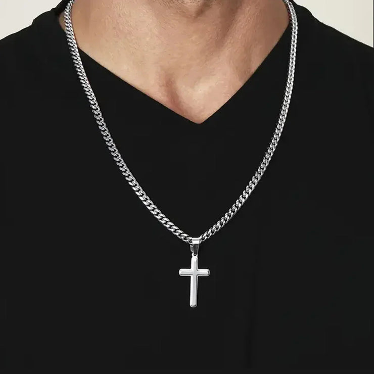 Silver cross necklace on man wearing black shirt faith based jewelry gift for son
