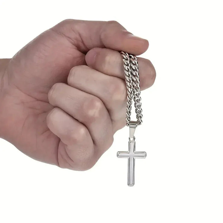 Silver cross necklace held in hand faith based jewelry gift for son by Fresh Faith Designs