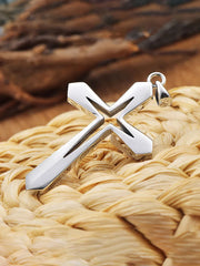 Silver cross pendant on woven natural fiber background faith based men's jewelry from Fresh Faith Designs
