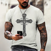 White faith based men's t-shirt with intricate black cross design worn by tattooed man holding a phone
