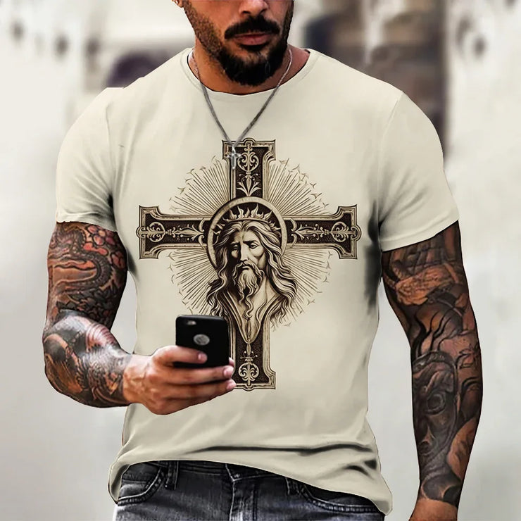 Faith based men's t-shirt featuring detailed Jesus face on ornate cross design worn by tattooed man