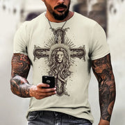Faith based men's t-shirt with lion and cross design worn by tattooed man holding phone