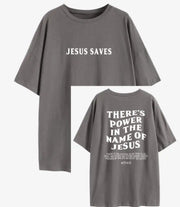 Gray faith based women's apparel t-shirt with Jesus Saves front and There's Power in the Name of Jesus back text