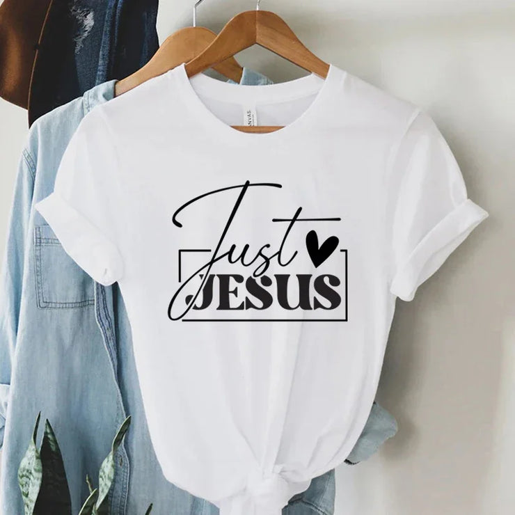 Fresh Faith Designs white faith-based women's apparel t-shirt with Just Jesus black text and heart graphic