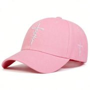 Pink Faith embroidery baseball cap with white stitched cross and adjustable strap
