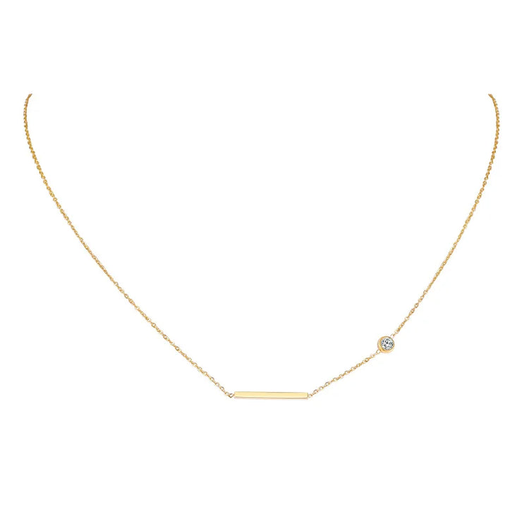Delicate gold necklace with a horizontal bar and small clear stone faith jewelry for women