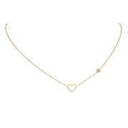 Delicate gold heart necklace with small crystal accent, a stylish piece of faith jewelry for women