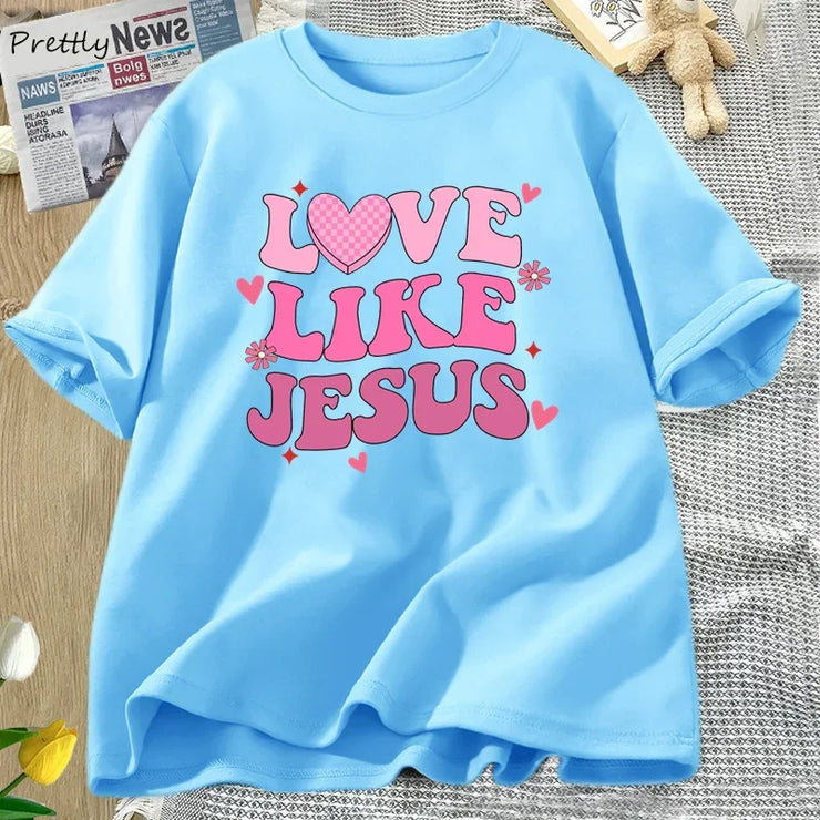 Fresh Faith Designs Love Like Jesus graphic tee in light blue with pink heart and text design