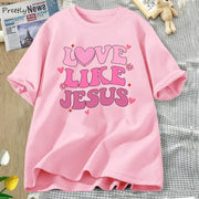 Pink Love Like Jesus graphic tee by Fresh Faith Designs with heart and flower accents