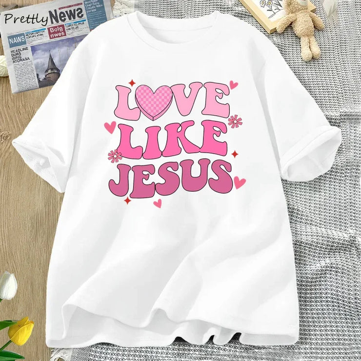 Fresh Faith Designs white Love Like Jesus graphic tee with pink heart and flower design